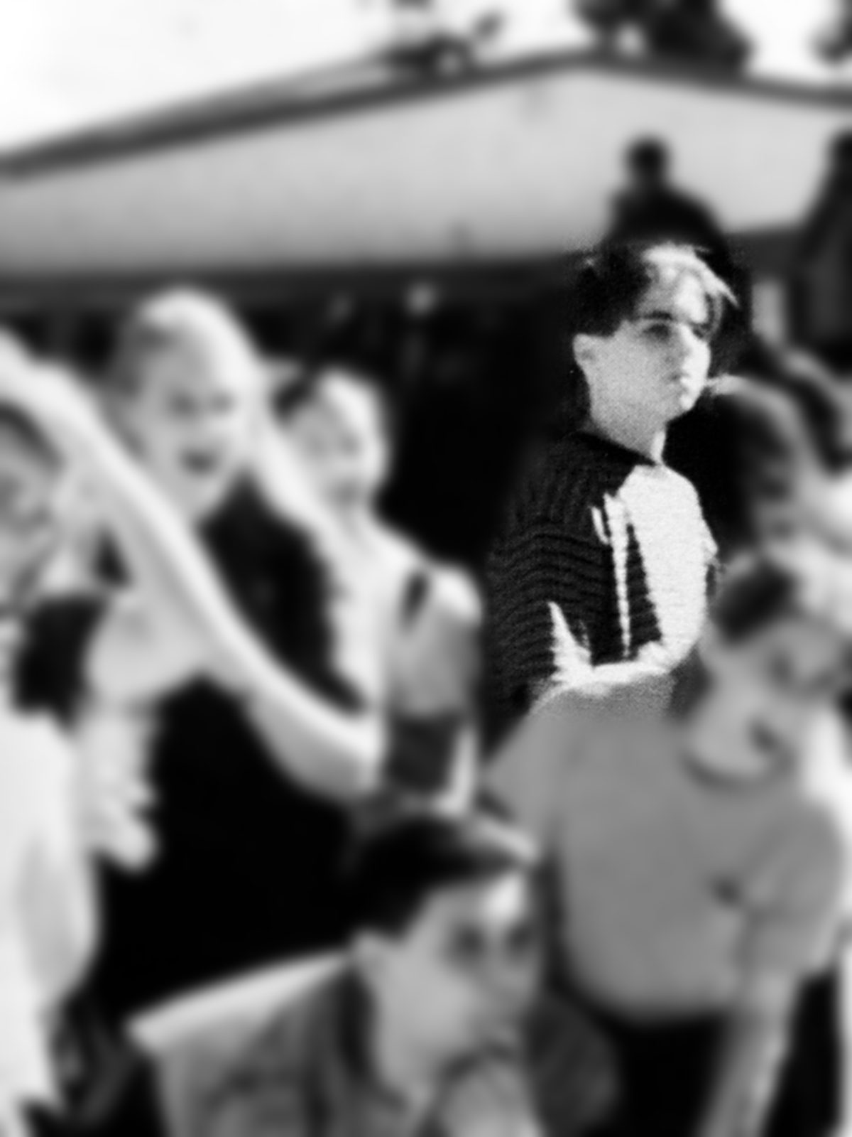 Chad Kempel as a tenth grader in a striped shirt, standing in a crowd of students at Arroyo High School