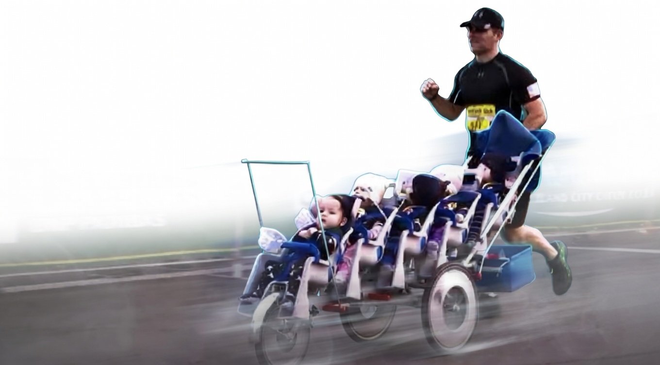 Chad Kempel pushing quintuple stroller at world record pace
