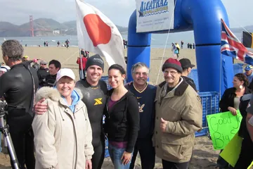 Chad Kempel in his wetsuit at the Alcatraz Challenge finish on May 22, 2011, with the Golden Gate Bridge behind him