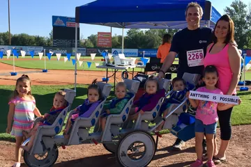 Chad Kempel and his family with the stroller after the 10K record in Garden City, Idaho