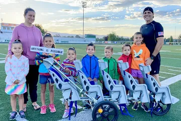 Chad Kempel with his wife and kids after the 1K stroller record in Eagle, Idaho