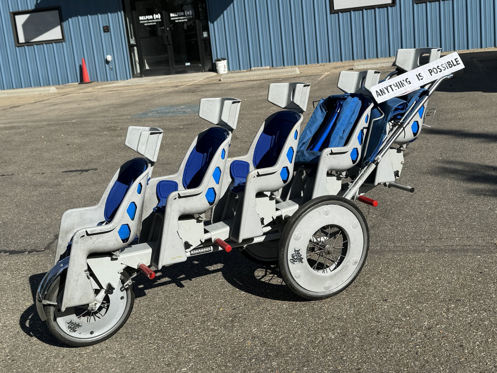 The five-seat stroller with the Anything Is Possible sign
