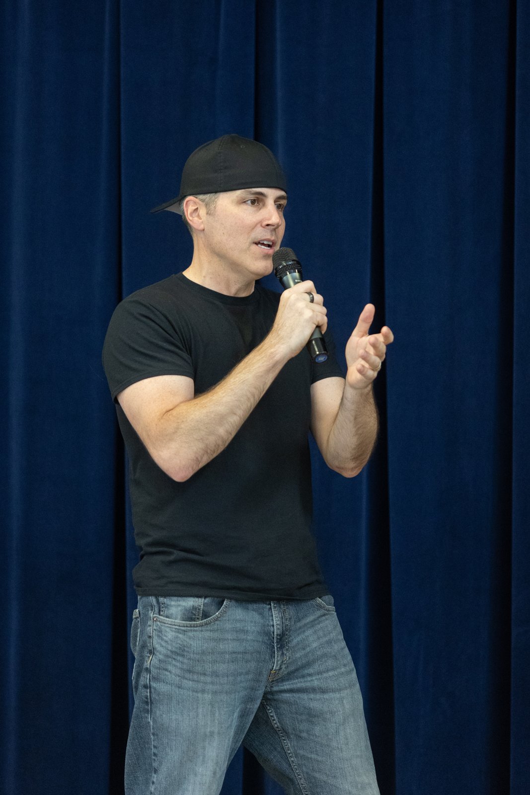 Chad Kempel speaking with a microphone